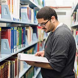 student in library